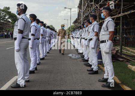 Kolkata, India. 11th Aug, 2020. A policeman wearing protective face mask, walks between two queues made by other policemen in a full dress rehearsal of Indian Independence day parade amid the coronavirus outbreak. (Photo by Jit Chattopadhyay/Pacific Press) Credit: Pacific Press Media Production Corp./Alamy Live News Stock Photo