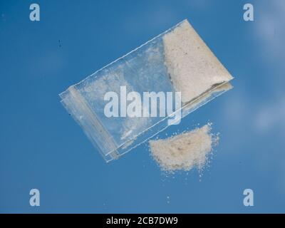 Drugs on a mirror with bag Stock Photo