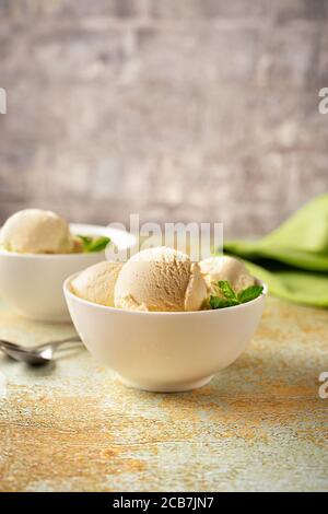 Disher Scoop with Blueberry Ice Cream Over Bowl Stock Image