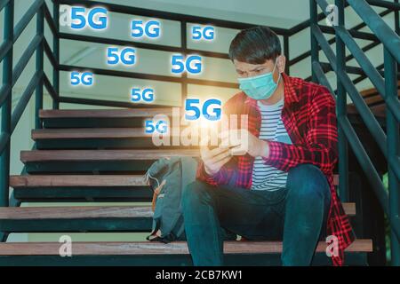 5G High speed internet network communication, man using mobile smartphone with 5G Stock Photo