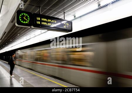 VIENNA, AUSTRIA - MAY 17, 2017: Subway underground station in Vienna (Austria) with a train running beside the platform, on may 17, 2017 Stock Photo