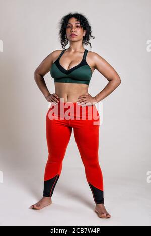 Plus size woman making sport and fitness. Studio portraits with curvy girl  Stock Photo - Alamy