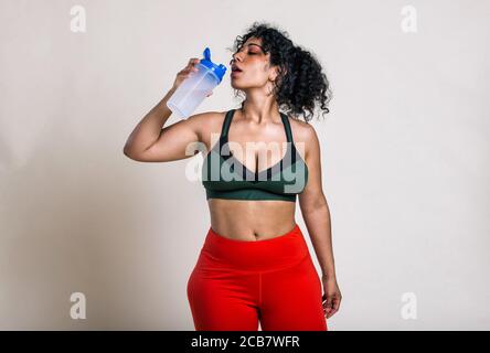 Plus size woman making sport and fitness. Studio portraits with curvy girl  Stock Photo - Alamy