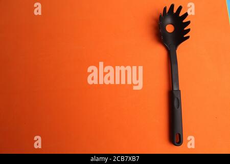 Cooking utensil isolated on an orange background Stock Photo