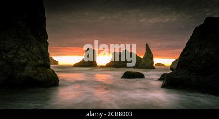 Fiery sunset over sea stacks in Bandon, Oregon, USA.  Stock Photo