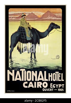 EGYPT Vintage 1900's Travel Poster National Hotel, Cairo Egypt - Egyptian Tourist Poster Egypt - Ouvert (Open) 1904 Illustrating a male explorer on a camel with pyramids in background Art printing by Richter & Co. Napoli Stock Photo