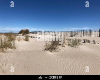 Wooden fences on beach, Plage de l'Espiguette, Grau du Roi, Gard, Occitanie, France Stock Photo