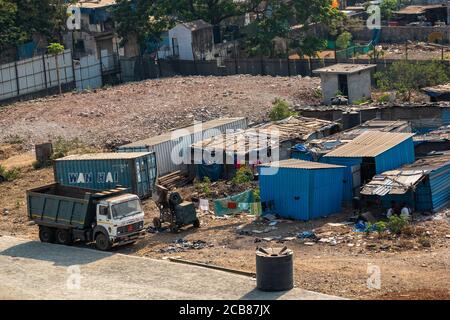 Mumbai, Maharashtra, India - March 2020: An aerial view of a cluster of slums in an industrial junkyard in suburban Mumbai. Stock Photo