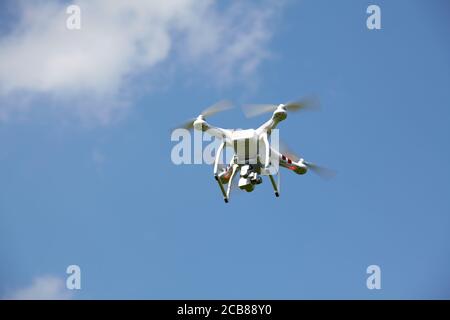 DJI Phantom Quad-copter in flight Stock Photo