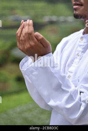 Religious muslim man praying hand. Stock Photo
