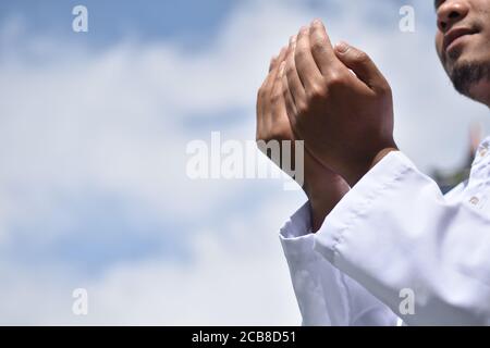 Religious muslim man praying hand. Stock Photo