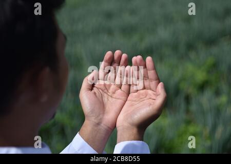 Religious muslim man praying hand. Stock Photo