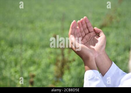 Religious muslim man praying hand. Stock Photo