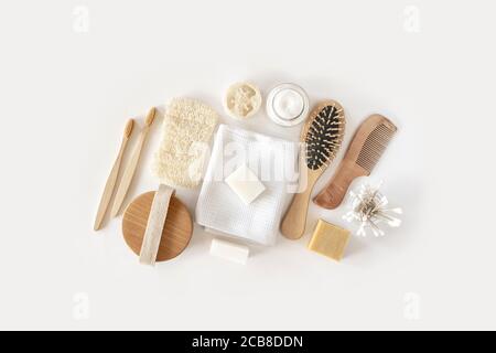 Zero waste concept. Set of eco friendly bathroom accessories on white background - natural soap, eco bag, bamboo toothbrush, natural hairbrush. Sustainable, eco-friendly lifestyle. Stock Photo