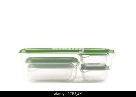 Small plastic containers for storing food inside a large one isolated on a white background. Close up. Copy space. Stock Photo