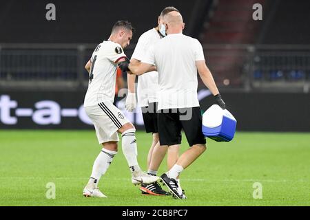 FC Basel's Taulant Xhaka leaves the field after being fouled during the