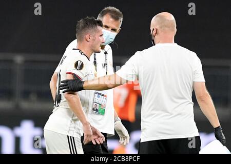 FC Basel's Taulant Xhaka leaves the field after being fouled during the