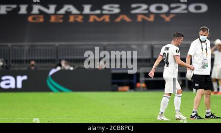 FC Basel's Taulant Xhaka leaves the field after being fouled during the