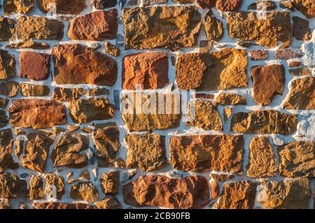 Rough sandstone wall closeup closeup as stone background Stock Photo