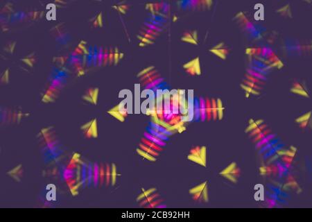 3D rendering or 3D rendering. Kaleidoscopic three-dimensional image. Symmetry with colored lights on a black background. Stock Photo