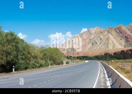 Osh, Kyrgyzstan - Pamir Highway (M41 Highway) on the Osh between Sary-Tash in Osh, Kyrgyzstan. Stock Photo