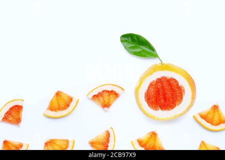 High vitamin C. Juicy grapefruit slices with leaf on white background. Stock Photo