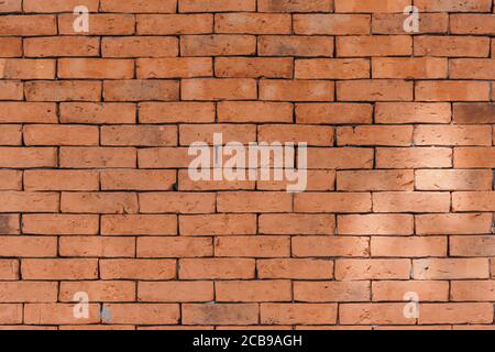 Orange bricks wall with sunlight Stock Photo