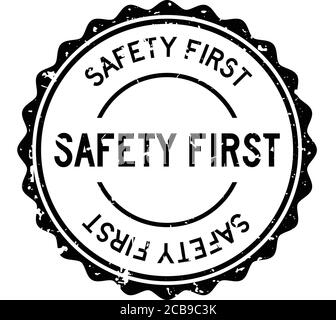 Grunge black safety first word round rubber seal stamp on white background Stock Vector