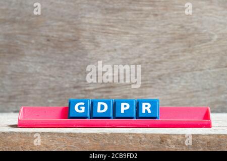 Tile letter on red rack in word GDPR (General Data Protection Regulation) on wood background Stock Photo