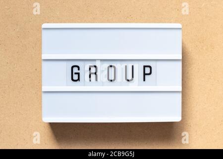 White lightbox with word group on wood background Stock Photo