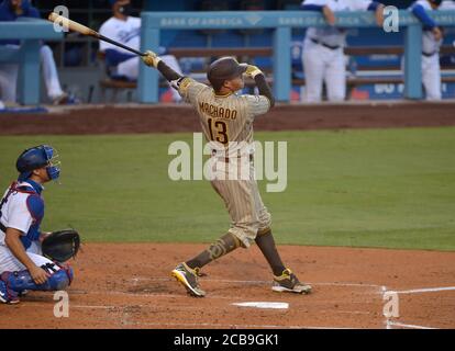 Los Angeles, United States. 11th Aug, 2020. San Diego Padres' Manny Machado  (C) celebrates with teammates after swatting a grand slam off Los Angeles  Dodgers' starting pitcher Ross Stripling in the third