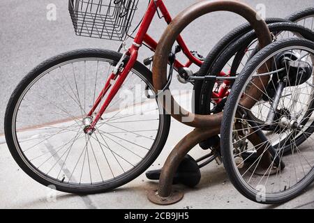 Close up picture of locked bicycle wheels, New York City, USA. Stock Photo