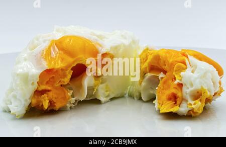 Boiled egg on a white plate, isolated on white background Stock Photo