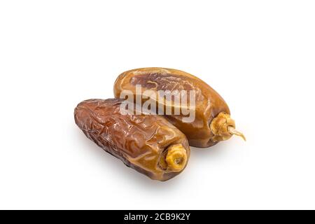 Dried Medjoul date fruit on white isolated background with clipping path. Dates palm is food for Ramadan or medjool month. Delicious dried fruit with Stock Photo