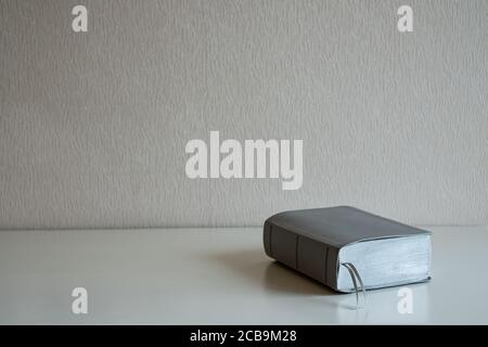 A book on the desk at gray wall background Stock Photo