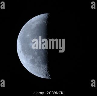 Wimbledon, London, UK. 12 August 2020. 42% Waning Crescent Moon photographed during the early hours of the morning in an outdoor temperature of 21 degrees. Credit: Malcolm Park/Alamy Live News Stock Photo