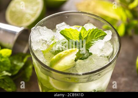 Mojito cocktail drink with white rum lime mint herbs and soda on the bar counter Stock Photo