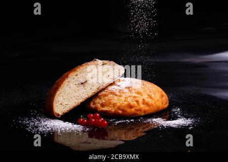 Sweet cupcake in round bread shape with filling. Photo in section. Stock Photo