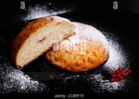 Sweet cupcake in round bread shape with filling. Photo in section. Stock Photo
