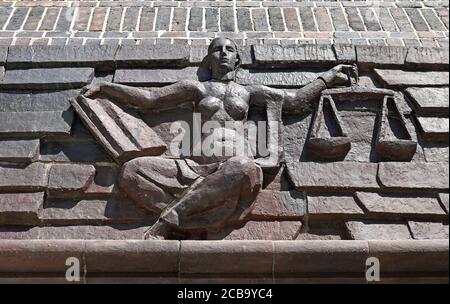 12 August 2020, Saxony, Chemnitz: View of the Justitia above the entrance at the district court of Chemnitz. Here the verdict in the trial of a man accused of two murders is expected. The accused is said to have strangled two brothers with an electric cable in their apartment in the summer of 1995. Both victim and perpetrator were Vietnamese. The background of the crime was illegal cigarette trade and protection racket. After the murder, the man had left for the Czech Republic, where he had lived under false identity. Last year he was arrested in Prague and transferred to Germany. Photo: Hendr Stock Photo