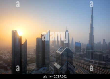 Dubai sunset panoramic view of downtown. Dubai is super modern city of UAE, cosmopolitan megalopolis. Stock Photo