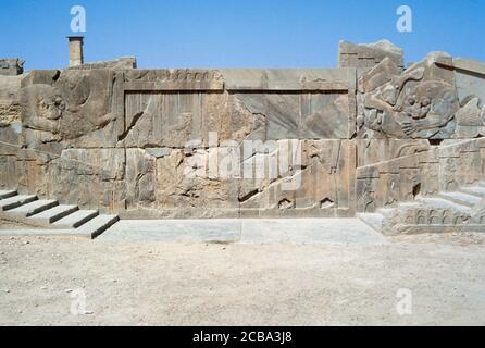 Iran. Persepolis. Capital of the Achaemenid Empire (ca. 550-330 BC). Palatial city built by  King Darius I and destroyed by Alexander the Great in 330 BC. Staircase of the Palace of Xerxes (Hadish). The walls are decorated with Lion-Bull motifs (symbol of the time cycle of the day; lion represents the sun and the bull represents the night). Stock Photo
