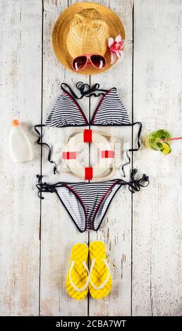 Beach accessories placed like figure of woman, top view. Summer holidays concept, free space for text. Very high resolution image Stock Photo