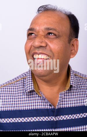 Portrait of happy mature overweight Indian businessman Stock Photo