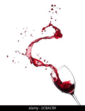 Red wine splashing from glass, isolated on white background. High resolution image Stock Photo