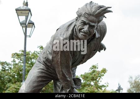 Bronze statue of the late fast bowler Fred Trueman, Canal Basin, Skipton, West Yorkshire, UK. Stock Photo