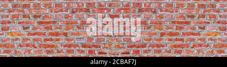 Panoramic rugged old red brown bricks wall texture. vintage retro industrial banner background. Stock Photo