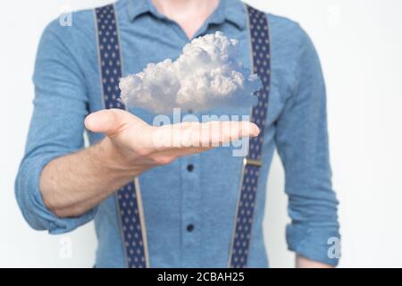 Man holding cloud. Cloud services, infrastructure, IT, hosted, hosted services, datacentre, web, in the cloud, offsite, backed up, at your fingertips Stock Photo