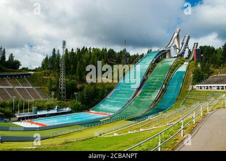 Lahti, Finland - 4 August 2020: Lahti sports centre with three ski jump towers and outdoor swimming pool Stock Photo