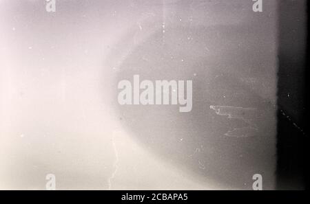 Noisy film frame with heavy noise, dust and grain. Abstract old film background Stock Photo